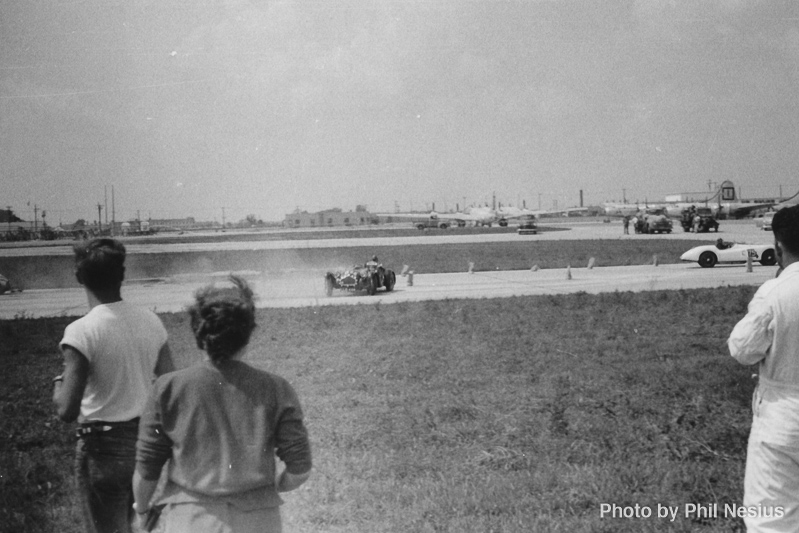 Allard J2  driven by Del Lee and Jaguar XK120 Silverstone number 75 driven by Chuck Leighton at Lockbourne AFB August 1953 / 493K_0010 / 