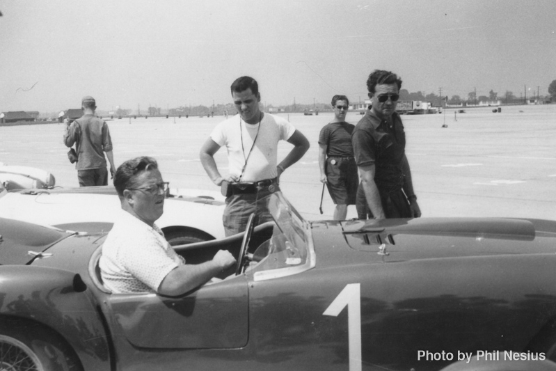 Bill Spear in a 1953 Ferrari 375MM Pininfarina Spyder with Briggs Cunningham in the background Lockbourne AFB August 1954 / 677L_0001 / 