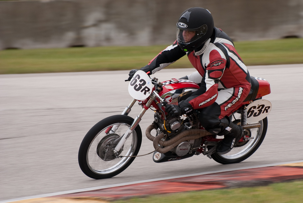 Eric Geiselman on a 1966 Honda, No 63R in the bend, Road America, Elkhart Lake, WI