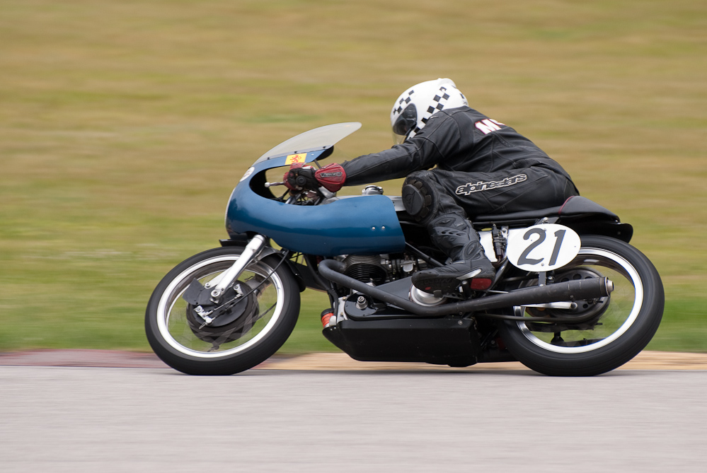 Gary Mccaw on a 1964 Triumph, No 21 in the bend, Road America, Elkhart Lake, WI