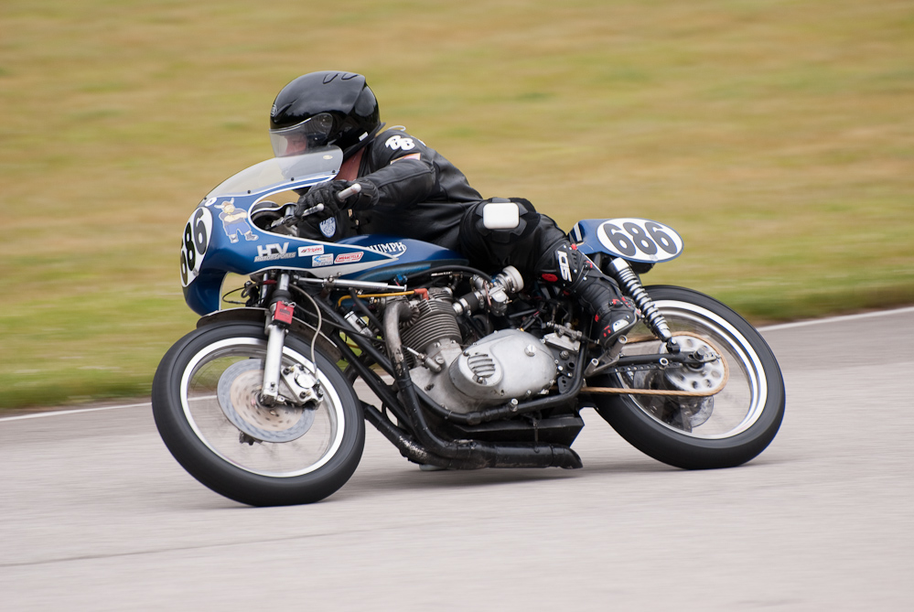 Chuck Skarsaune on a Triumph, No 686 in the bend, Road America, Elkhart Lake, WI