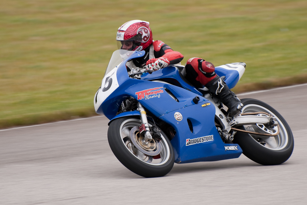 Greg Comstock riding a 2001 Suzuki, No 75 in the bend, Road America, Elkhart Lake, WI