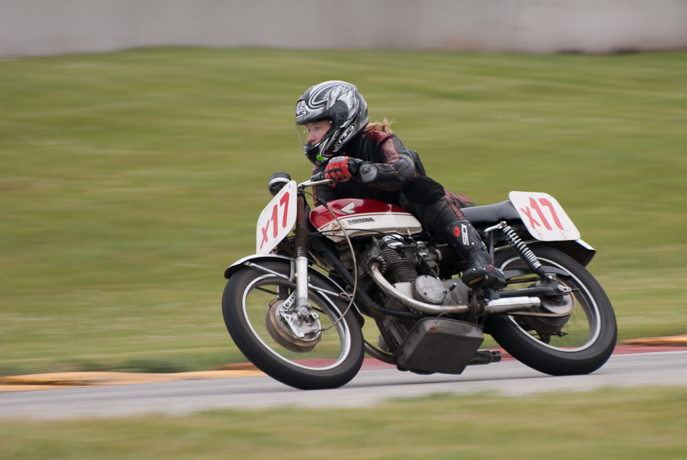 Karena Bierman on a 1970 Honda, No X17 in the bend, Road America, Elkhart Lake, WI
