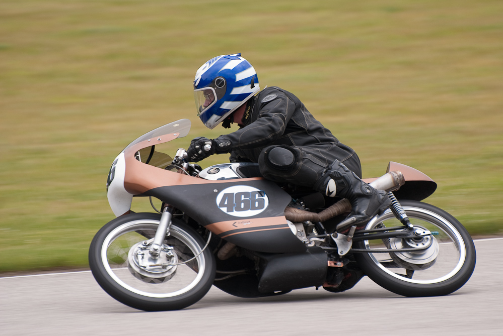 Perry Bradley riding a 1966 Honda, No 466 in the bend, Road America, Elkhart Lake, WI

