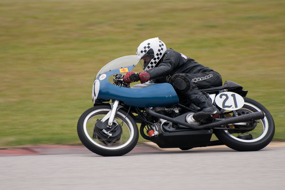 Gary Mccaw on a 1964 Triumph, No 21 in the bend, Road America, Elkhart Lake, WI