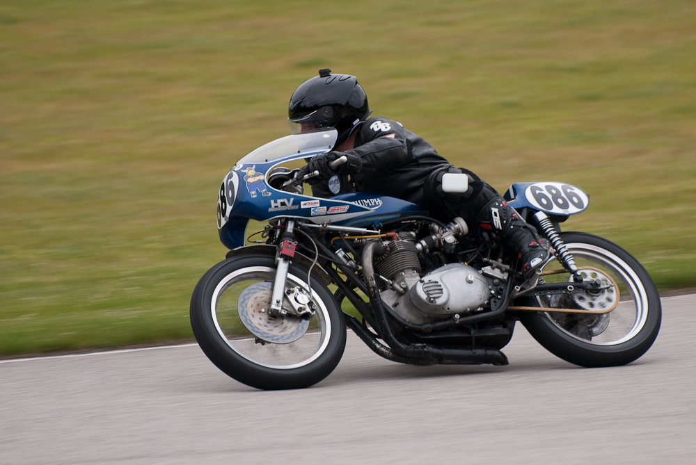 Chuck Skarsaune on a Triumph, No 686 in the bend, Road America, Elkhart Lake, WI