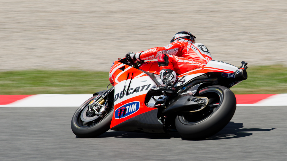 Andrea Dovizioso on the #04 GP13 Ducati Desmosedici GP13 at Circuit de Catalunya turn 3 / DSC_6197