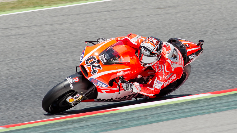 Andrea Dovizioso on the #04 GP13 Ducati Desmosedici GP13 at Circuit de Catalunya turn 2 / DSC_6256