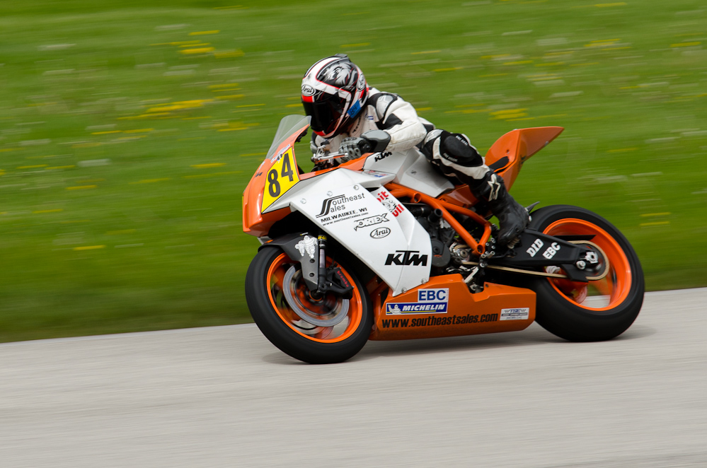 DSC_1870 / John Erdmann on the No 84 KTM in turn 9 at Road America, Elkhart Lake, WI