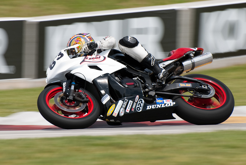 Marie-Josee Boucher, No. 83 on the Boucher Racing Honda CBR600RR in turn 7, Road America, Elkhart Lake, WI