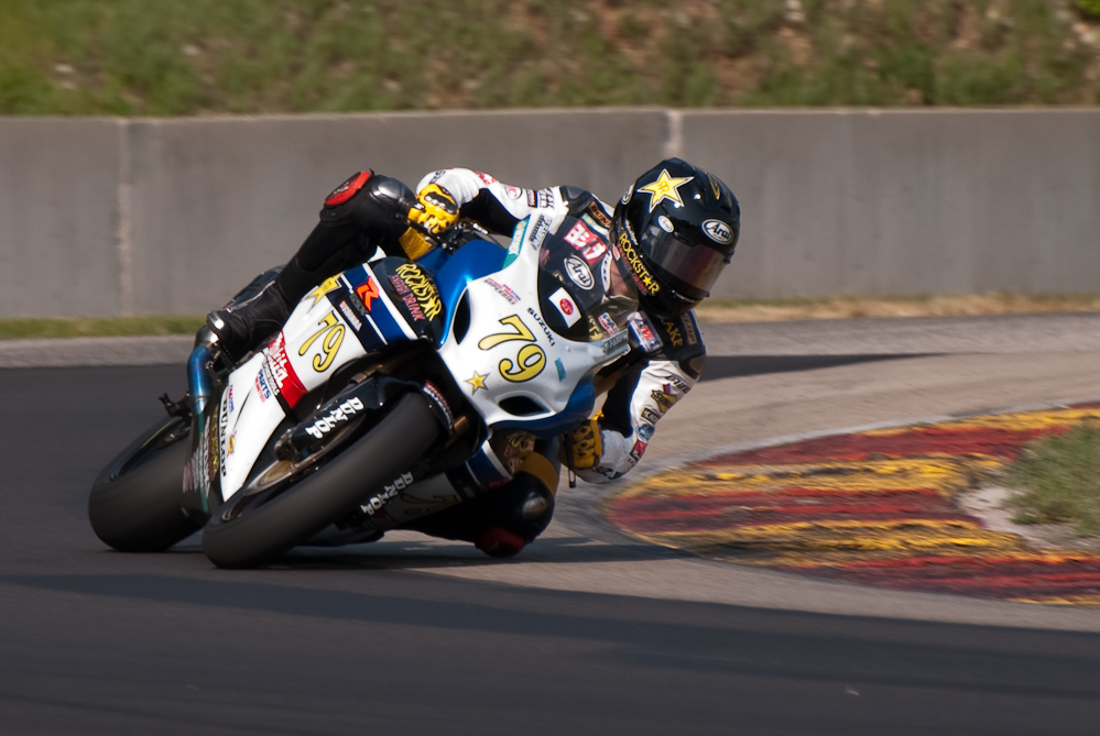 Blake Young on the No 79 Rockstar ·Makita Suzuki GSX-R1000 in turn 6, Road America, Elkhart Lake, WI