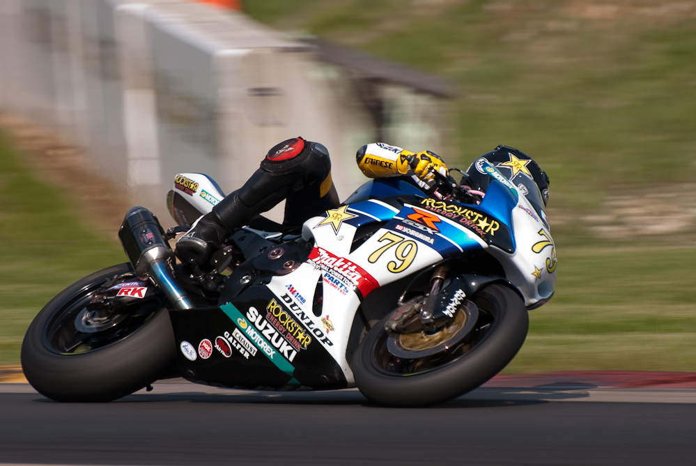 Blake Young on the No 79 Rockstar ·Makita Suzuki GSX-R1000 in turn 6, Road America, Elkhart Lake, WI