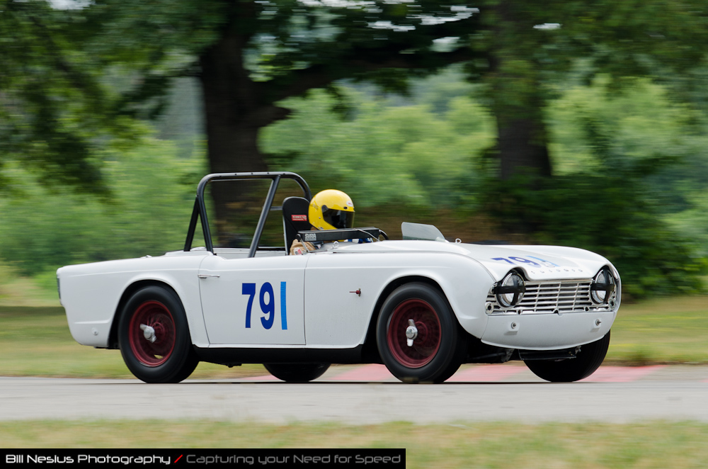 DSC_6430 / 1961 Triumph TR4 driven by Kenneth Suhre in turn 4. Blackhawk Farms Raceway