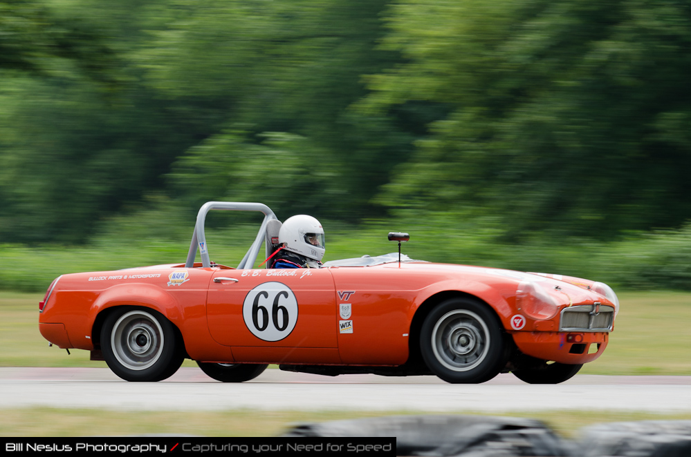 DSC_6437 / 1966 MG B car No 66, driven by Bishop Bullock in turn 4. Blackhawk Farms Raceway