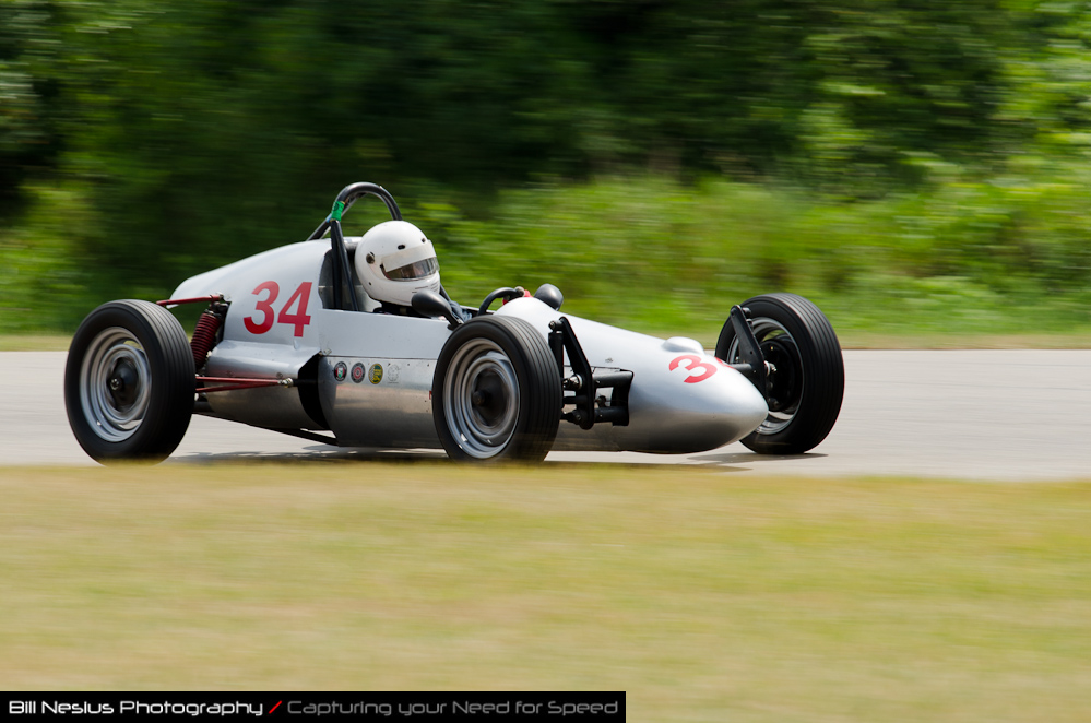 DSC_6508 / 1965 Bobsy Vega driven by Ricky delRosario in turn 2-3. Blackhawk Farms Raceway