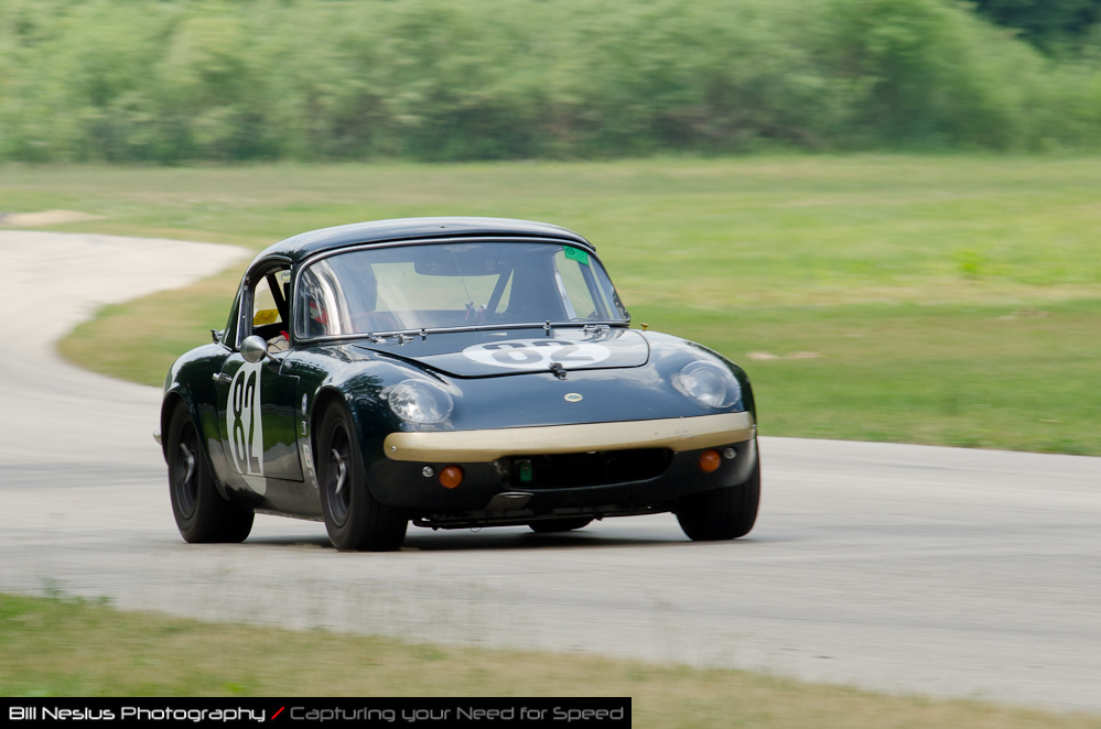 DSC_7054 / 1964 Lotus Elan 26R Car No 82, driven by Jeff Fisher in turn 2-3. Blackhawk Farms Raceway.\
