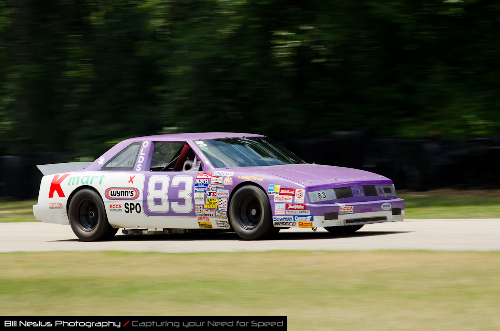 DSC_7096 / 1987 Oldsmobile Delta 88 Car 83, driven  by Richard Sharer in turn 3. Blackhawk Farms Raceway.