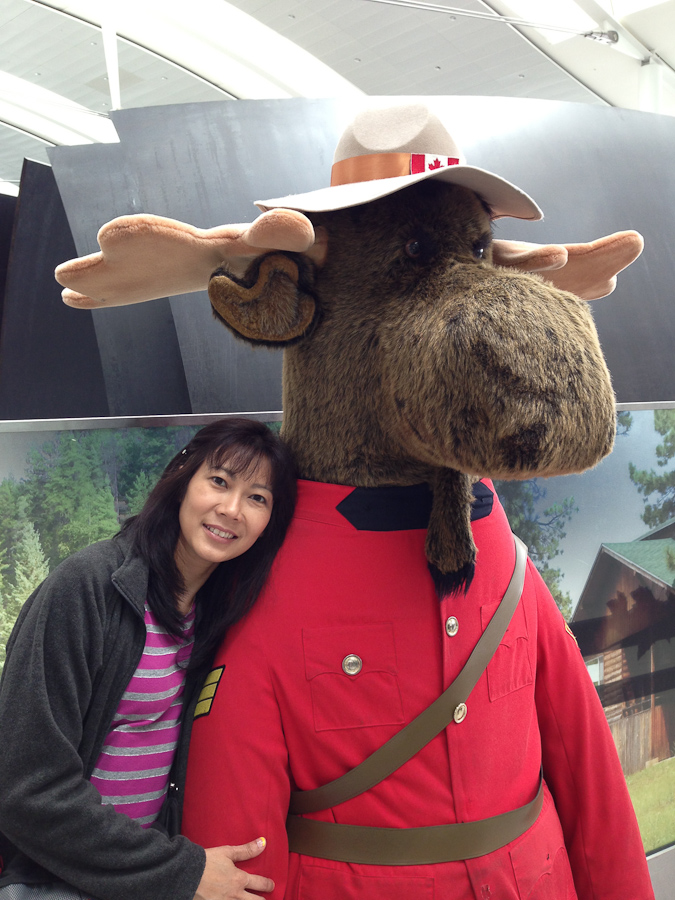 iPhone pic - Sutaya making friends in the airport in Canada. / IMG_0849